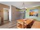 Dining area with a custom wood table and access to kitchen area at 13131 Early Run Ln, Riverview, FL 33578