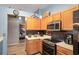 Charming kitchen features light wood cabinets, stainless steel appliances, and modern finishes at 13131 Early Run Ln, Riverview, FL 33578