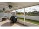 Enjoy outdoor living on this screened lanai with views of the fenced backyard and pond at 13131 Early Run Ln, Riverview, FL 33578