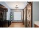 Pantry area with barn doors and ample shelving adjacent to kitchen appliances at 13131 Early Run Ln, Riverview, FL 33578