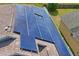 Close-up of a roof with solar panels, highlighting the sustainable energy feature of this home at 13131 Early Run Ln, Riverview, FL 33578