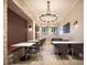 Stylish dining room featuring modern tables, comfortable seating, and decorative lighting at 13511 White Gold Run, Parrish, FL 34219