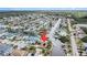 Aerial shot pinpoints home's canal-front location in a tranquil neighborhood setting at 15528 Allmand Dr, Hudson, FL 34667