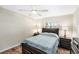 Bedroom with a wood bed frame, matching wood dressers, and a sunny window at 15528 Allmand Dr, Hudson, FL 34667