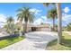Lovely single Gathering home with a large driveway, attached garage, and stunning landscaping at 15528 Allmand Dr, Hudson, FL 34667