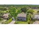 Aerial view showcasing a two-story home with lush landscaping in a serene neighborhood at 16528 Oley Ridge Ct, Tampa, FL 33624