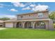 Charming two-story home with a manicured front lawn and a spacious two-car garage at 16528 Oley Ridge Ct, Tampa, FL 33624