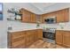 Bright kitchen features well-kept wooden cabinets, tile backsplash, and stainless steel appliances at 16528 Oley Ridge Ct, Tampa, FL 33624