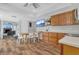 Open kitchen and dining area features wood floors, recessed lights, and lots of cabinets at 16528 Oley Ridge Ct, Tampa, FL 33624