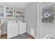 Practical laundry area with washer, dryer, storage and direct outdoor access at 16528 Oley Ridge Ct, Tampa, FL 33624