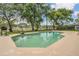Sparkling pool with a basketball hoop, perfect for outdoor fun and relaxation at 16528 Oley Ridge Ct, Tampa, FL 33624