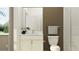 This bathroom features a toilet, sink with mirror, and a stand-up shower at 18148 Serene Lake Loop, Lutz, FL 33548