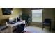 Functional home office with a desk, comfortable seating, and ample natural light creating a productive workspace at 18412 Oriole St, Lutz, FL 33558