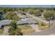 Aerial view of a home showcasing its roof, driveway, nearby roads and landscaping at 1894 Union St, Clearwater, FL 33763