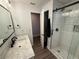 Stylish bathroom featuring a sleek vanity, marble countertop, and a glass-enclosed shower with modern fixtures and design at 1894 Union St, Clearwater, FL 33763