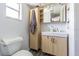 Bathroom featuring a modern vanity, medicine cabinet and shelving for extra storage at 1894 Union St, Clearwater, FL 33763