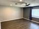 Modern bedroom with gray accent wall and laminate flooring at 1894 Union St, Clearwater, FL 33763