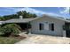 Charming single-story home with a well-manicured front yard and classic architectural details at 1894 Union St, Clearwater, FL 33763