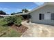 Exterior view of a home with landscaping, a sidewalk, and a driveway at 1894 Union St, Clearwater, FL 33763