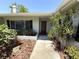 Charming front entrance featuring a well-manicured yard and a covered porch at 1894 Union St, Clearwater, FL 33763