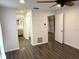 Open hallway featuring wood-look floors and access to the bedroom and bathroom at 1894 Union St, Clearwater, FL 33763