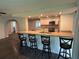 Kitchen features breakfast bar, stainless steel appliances, and granite countertops at 1894 Union St, Clearwater, FL 33763