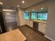Spacious kitchen with granite countertops, stainless steel appliances, and a view to backyard at 1894 Union St, Clearwater, FL 33763