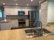 Well-lit kitchen features stainless steel appliances, granite countertops, and ample cabinet space at 1894 Union St, Clearwater, FL 33763