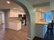 Open kitchen with granite countertops, stainless steel appliances, and breakfast bar seating at 1894 Union St, Clearwater, FL 33763