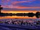 Scenic lake view at sunset with vibrant colors reflecting on the water's surface at 1894 Union St, Clearwater, FL 33763
