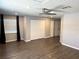 Spacious living room featuring wood floors, neutral walls, and a modern ceiling fan at 1894 Union St, Clearwater, FL 33763