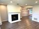 Spacious living room with a painted brick fireplace and modern flooring at 1894 Union St, Clearwater, FL 33763
