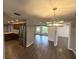 Spacious open floor plan between kitchen and living room featuring wood floors and natural light at 1894 Union St, Clearwater, FL 33763