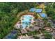 Aerial view of the community pool, clubhouse, playground, tennis courts and parking area at 20123 Bay Cedar Ave, Tampa, FL 33647