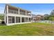 Exterior view of the back of the house, including the backyard and screen patio at 20123 Bay Cedar Ave, Tampa, FL 33647