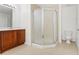 Bathroom with a glass door shower and neutral ceramic tile flooring at 20123 Bay Cedar Ave, Tampa, FL 33647