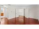 Bedroom showcasing hardwood floors and open doors to the rest of the home at 20123 Bay Cedar Ave, Tampa, FL 33647