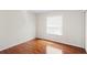 Bright bedroom features wood flooring, natural light, and ample closet space at 20123 Bay Cedar Ave, Tampa, FL 33647