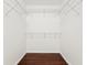 Walk-in closet with wire shelving and hardwood floors at 20123 Bay Cedar Ave, Tampa, FL 33647