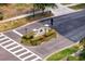 Community entrance sign to Beachwood Village with manicured landscaping and pedestrian crosswalk at 20123 Bay Cedar Ave, Tampa, FL 33647