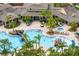 Resort-style community pool featuring a splash pad, hot tub, and plenty of lounge seating with palm trees at 20123 Bay Cedar Ave, Tampa, FL 33647