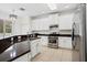 Well-equipped kitchen with dark granite countertops and stainless steel appliances at 20123 Bay Cedar Ave, Tampa, FL 33647