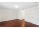 Spacious living room with beautiful dark hardwood floors and neutral walls at 20123 Bay Cedar Ave, Tampa, FL 33647