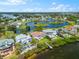 Spectacular aerial view of waterfront properties with pools and docks, highlighting lake access at 2081 Pointe Alexis Dr, Tarpon Springs, FL 34689