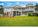 Spacious backyard featuring a multi-level deck and ample space for outdoor activities and entertaining at 2081 Pointe Alexis Dr, Tarpon Springs, FL 34689