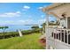 Backyard view from the upper deck overlooking the perfectly manicured yard and private dock at 2081 Pointe Alexis Dr, Tarpon Springs, FL 34689