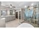 Spacious bathroom featuring dual sinks, walk-in shower, and neutral color palette at 2081 Pointe Alexis Dr, Tarpon Springs, FL 34689