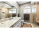 Bathroom featuring granite counters, walk-in shower, and neutral color palette at 2081 Pointe Alexis Dr, Tarpon Springs, FL 34689