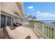 Waterfront deck with outdoor seating, showcasing the home's ideal location for enjoying waterfront living at 2081 Pointe Alexis Dr, Tarpon Springs, FL 34689