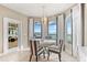Charming dining area with a water view, featuring a round table, stylish chairs, and natural light at 2081 Pointe Alexis Dr, Tarpon Springs, FL 34689